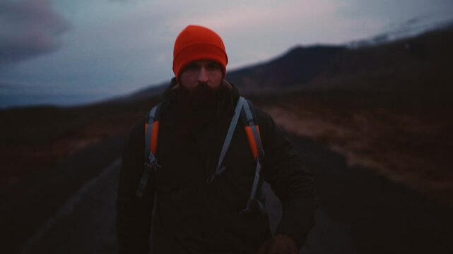 Man Experiencing Car Breakdown in Remote Icelandic Landscape