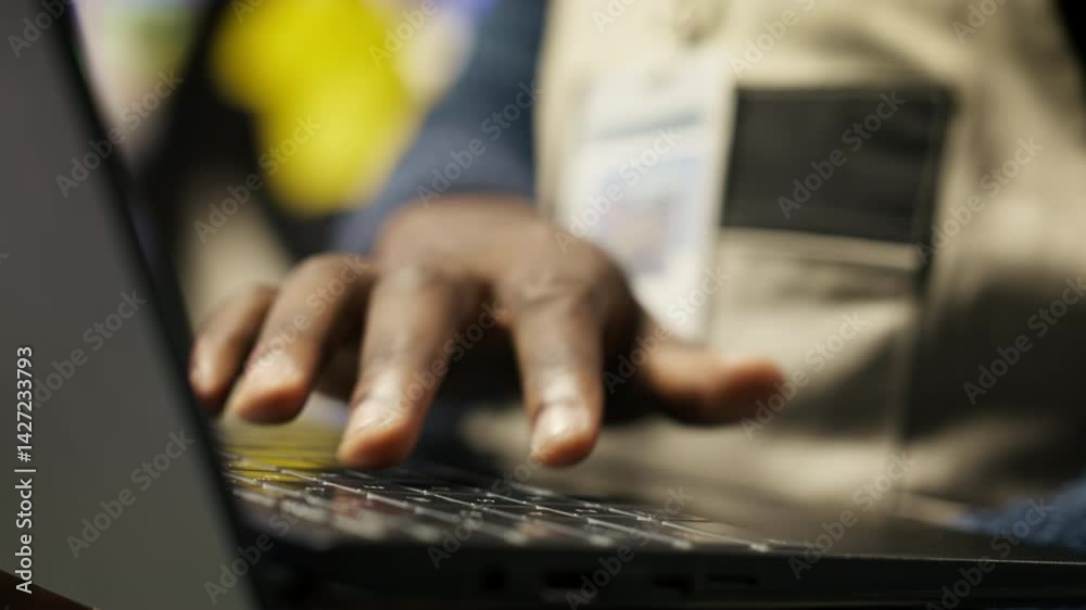 Poster close up of smart factory worker using laptop to test automated systems, monitoring production metri