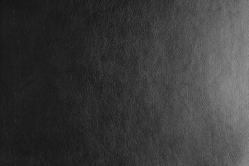 Glossy structure of genuine leather with gradient lighting effect, natural skin surface with embossing pattern. Artifical gray colored leatharette macro texture. Background, wallpaper, backdrop.