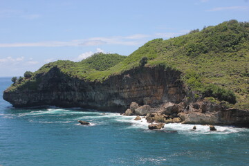 cliff at the beach of java coastline