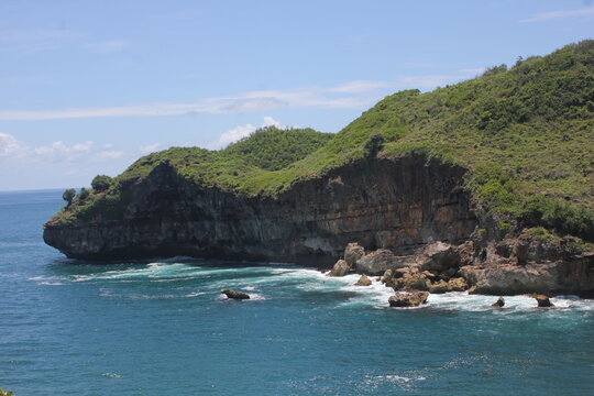 cliff at the beach of java coastline