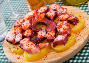 Pulpo a la Gallega or Spanish octopus. Typical Spanish dish from Galicia of delicate octopus with potatoes and paprika..