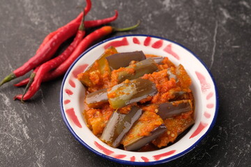 Balado Terong. Eggplant cooked with red chili, shallot, garlic, lemongrass, salt, lime leaves. Indonesian food..