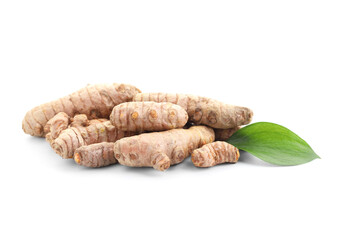 Raw turmeric roots and green leaf isolated on white