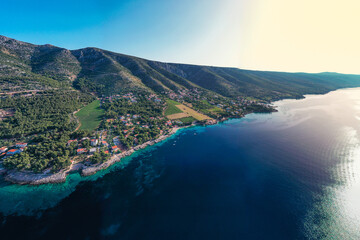 Fototapeta premium Aerial drone view of Zavala village on south side of island Hvar in summer