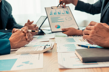 Conference room using laptop digital tablet and working on documents business people having meeting in modern office close up