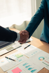 Concept of business negotiation and handshake to show connection between people in making deal with close up photo of business partners shaking hands.