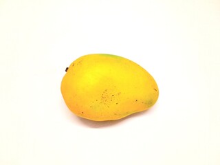 Whole yellow colour mango isolated on white background. 