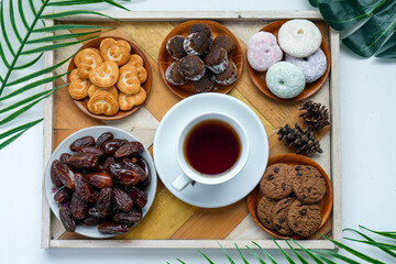 Arrangement Of Various Snacks With Hot Tea And Dates Fruit For Iftar Time During Ramadan Month