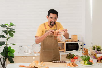 Asian bearded man introducing ingredients and cooking process communicating with subscribers...