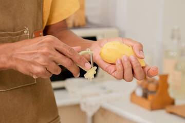 Asian man enjoy making main courses, Smart father is cooking pasta for his daughter in the morning. Happy man was boiling the soup and Stirring the boiling broth. Male preparing breakfast at home.