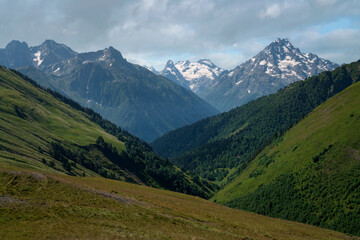 Fototapeta premium View of the peaks of the North Caucasus mountains near the Arkhyz ski resort on a sunny summer day, Karachay-Cherkessia, Russia