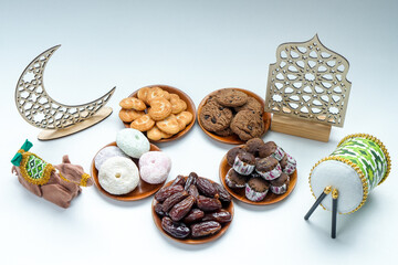 High Angle Of Assortment Food Snacks With Ramadan Ornament Over White Background