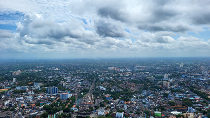 Aerial View of Urban Landscape Under Cloudy Sky.