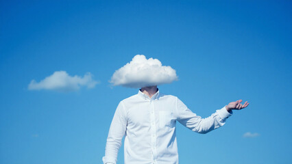 Person with cloud head against blue sky