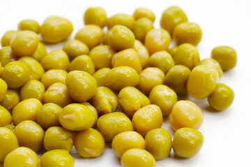 Canned green peas on white background.