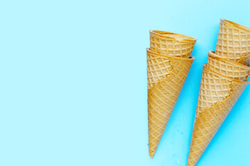 Waffle cones on blue background