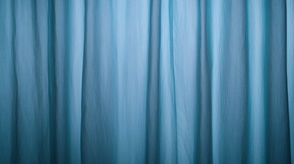 Obraz premium A smooth, flowing curtain in a calming blue hue, creating a serene atmosphere with soft folds and textures.