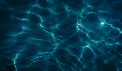sand sea bottom in dark blue , top view