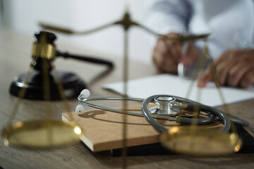 medicine law A doctor and a lawyer discussed health care, justice, and ethics in a clinic, balancing safety, rights, and responsibility.