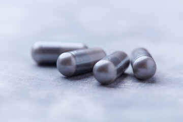 BCAA amino acids tablets. Nutrition for bodybuilding. Fitness supplements on bright background. Soft focus. Copy space.