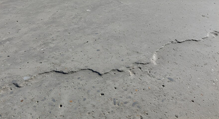 Concrete Pavement With an Oblique Fracture on a Bright Day