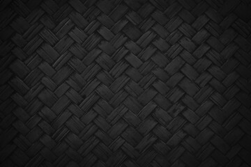 Black bamboo weaving pattern, old woven rattan mat texture for background and design art work.