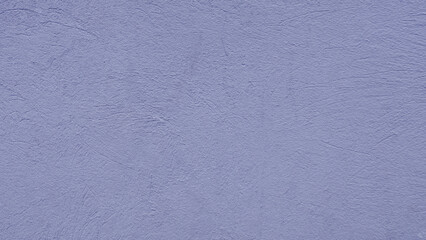 Surface of a blue painted concrete wall.