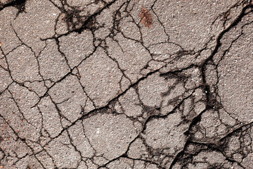 Abstract texture of cracked asphalt.