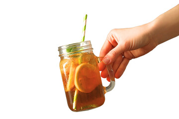 Hand holding a mason jar of iced tea with lemon slices and a straw, isolated on white, PNG