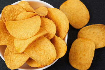 Crunchy potato chips in a bowl for a perfect snack time treat