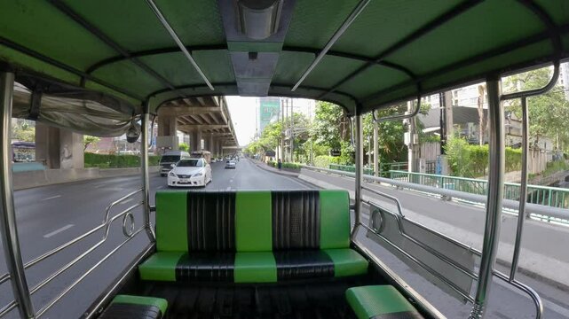 Bangkok, Thailand - 20 April 2025: View from inside a "Rot Song Thaeo", a type of shared taxi or minibus, traveling along Borommaratchachonnani Road in the Pinklao area.