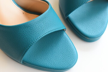 texture of green high heels shoes on white background