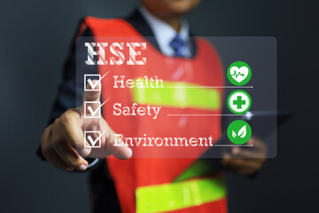 health safety environment concept with a safety staff pointing to manage the work place to complied and meet safety regulation requirement and life quality of staff in employment