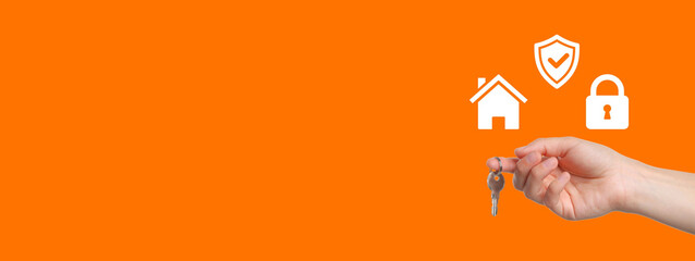 Keys are being held in a hand with symbols of home security on a bright background