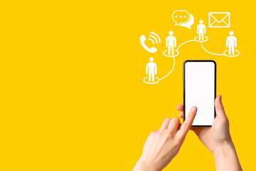 Hand holds a smartphone showing different communication methods on a bright backdrop