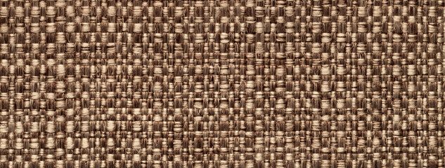 Texture brown color background from woven textile material with wicker pattern, macro. Structure vintage beige fabric