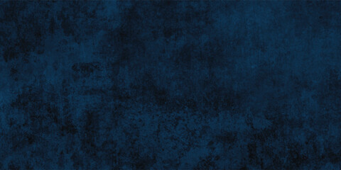 Fototapeta premium Mysterious dark blue textured background with an industrial and slightly rough feel. 