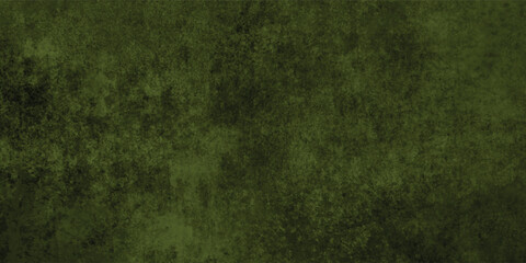 Close-up of a dark green grunge texture revealing intricate grainy details and rough surface.
