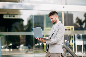 Businessman standing outdoors and using digital tablet. Perfect for corporate, technology, and professional themes