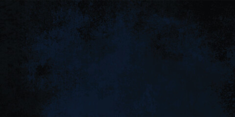 Fototapeta premium Shaded dark blue gradient background with a textured and slightly uneven appearance. 