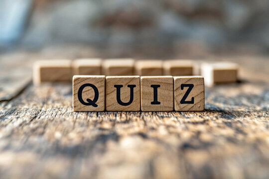 Wooden letter blocks spelling "QUIZ" placed on a rustic wooden surface with blurred background. Great for education, trivia games, learning tools, and test-related themes.