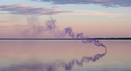 Obraz premium Mystical Purple Haze Over Calm Water During Sunset With Dreamy Sky