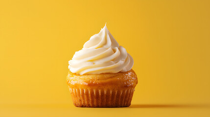 Golden Treat: a single frosted cupcake against a vibrant yellow backdrop, inviting with its creamy swirls and moist, inviting appearance.