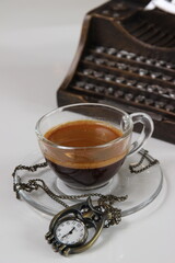 a cup of espresso coffee with rustic theme