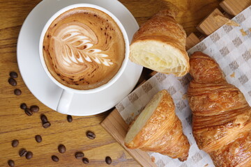 sliced croissants and a cup of cappuccino