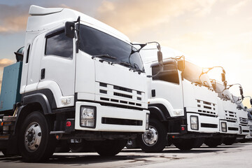 Semi Trucks Parked on The Parking Lot. Big Rig, Tractor Truck. Shipping Cargo Container Trucks at The Port. Economy Business Transport on Road. Trucking. Freight Logistics Truck Transportation.	

