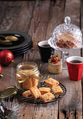 Almond Cookies on the wire colling rack with the red lamp