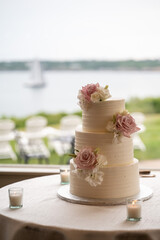 Elegant Coastal Wedding Cake with Floral Accents