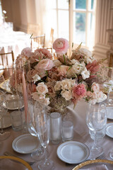 Romantic blush floral centerpiece on formal dinner table